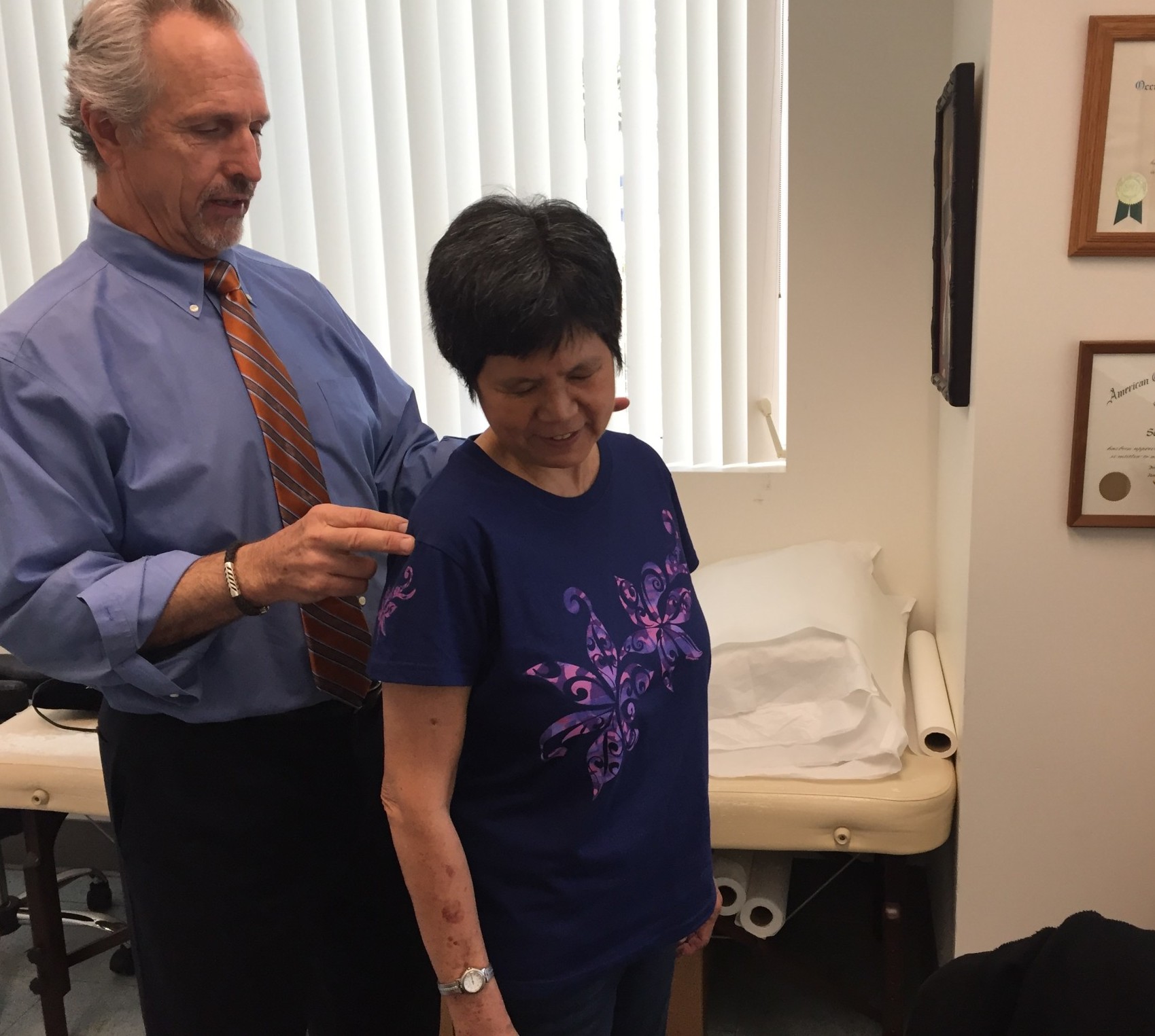 Dr. Scott McCaffrey examines Bonnie Chan at WorkStar Injury Recovery Center in Ewa Beach Dr. Scott McCaffrey examines Bonnie Chan at WorkStar Injury Recovery Center in Ewa Beach