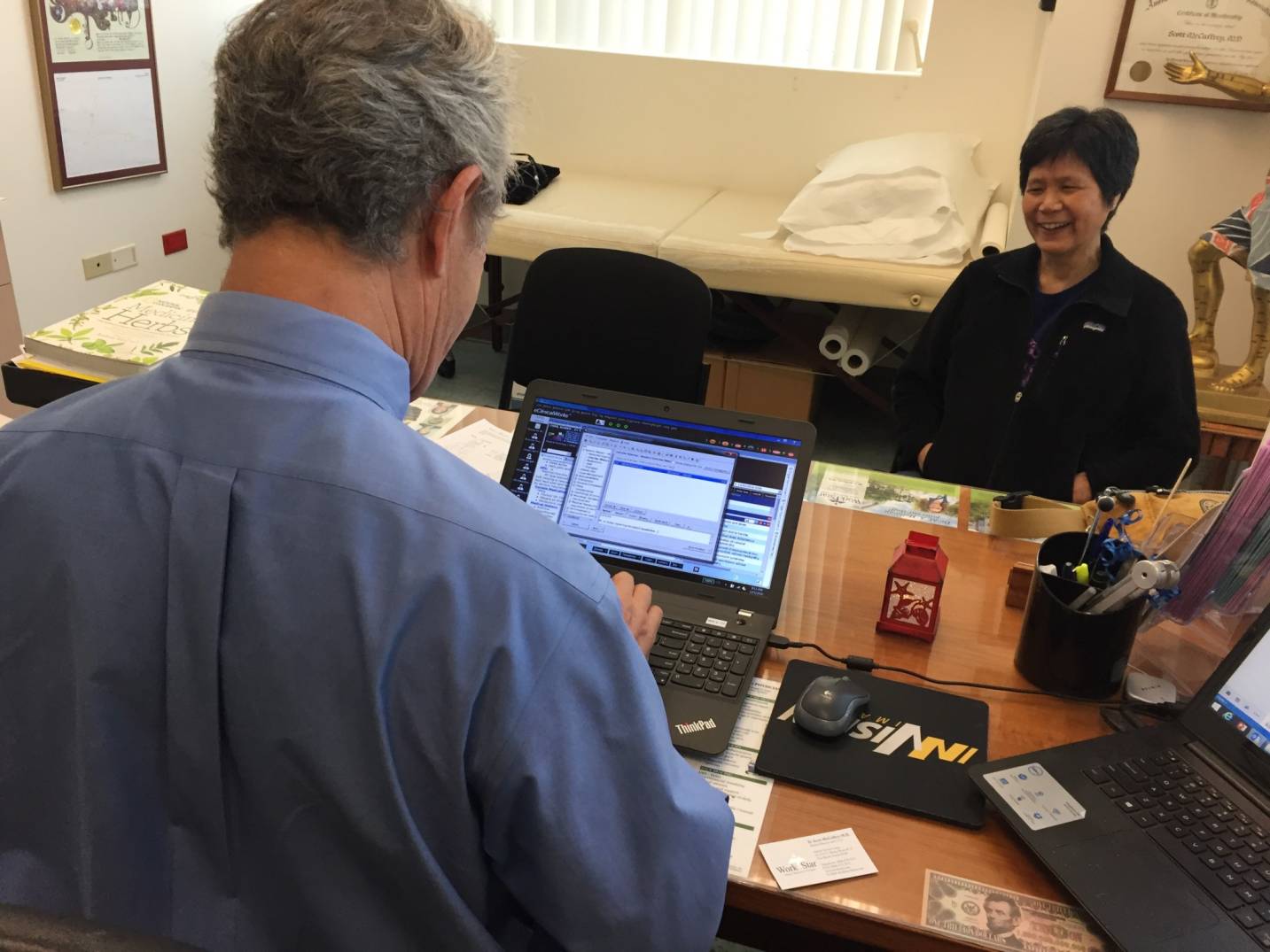 Dr. Scott McCaffrey interviews injured worker Bonnie Chan. Dr. Scott McCaffrey interviews injured worker Bonnie Chan.